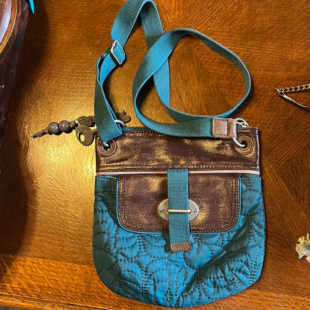 Teal quilted Fossil crossbody bag with key detail